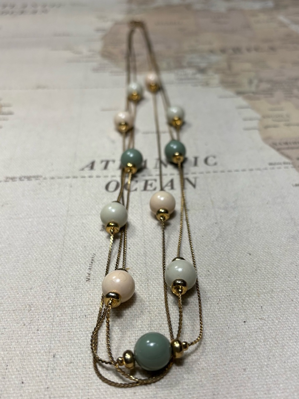 Layered Gold Bead Necklace with Mint Green and Cream Beads